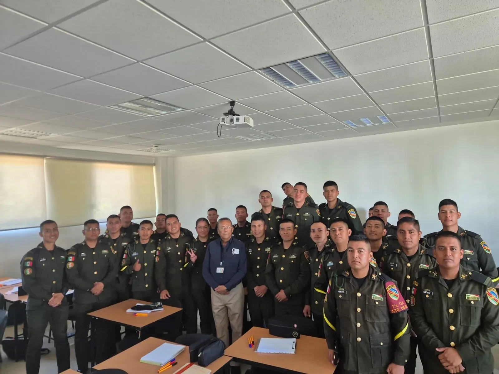 Captain José Arturo Zepeda, 77, with a group of sergeants in his classroom at the Military School for Sergeants